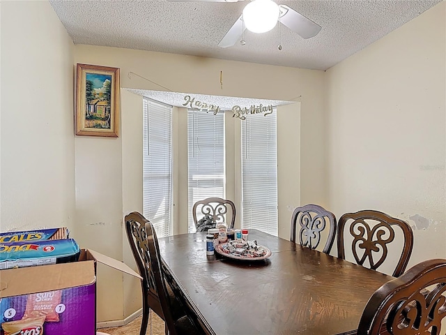 1806 Foxhall Cir Unit 1806, Kissimmee, FL 34741 - dining room featuring a ceiling fan and a textured ceiling