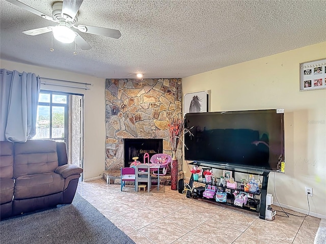 1806 Foxhall Cir Unit 1806, Kissimmee, FL 34741 - living room featuring a textured ceiling, ceiling fan, tile patterned flooring, baseboards, and a fireplace