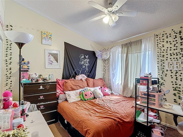 1806 Foxhall Cir Unit 1806, Kissimmee, FL 34741 - carpeted bedroom with a textured ceiling and ceiling fan