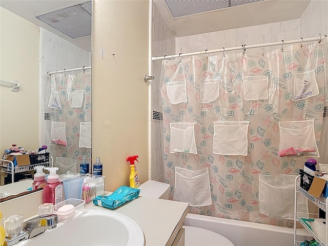 1806 Foxhall Cir Unit 1806, Kissimmee, FL 34741 - bathroom featuring shower / bath combination with curtain, toilet, and vanity