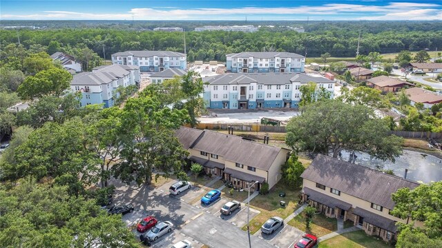 1806 Foxhall Cir Unit 1806, Kissimmee, FL 34741 - aerial view of residential area with a heavily wooded area