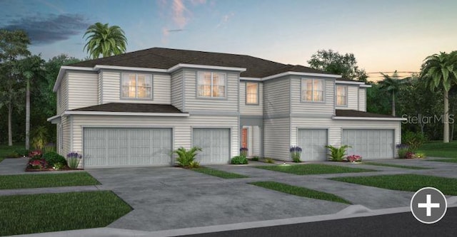 view of front of home with a garage and driveway