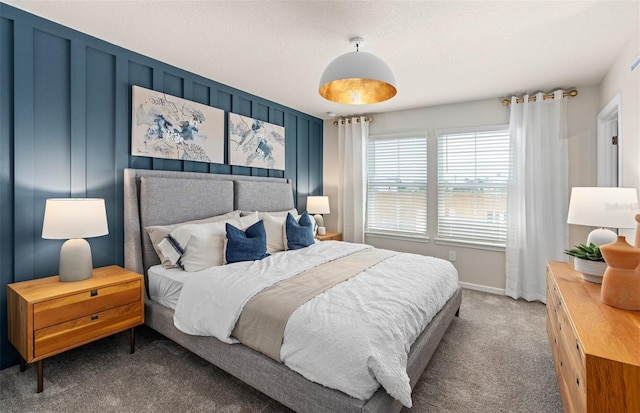 carpeted bedroom with baseboards