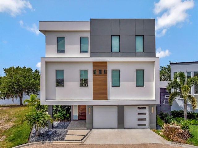 8157 Elion St, Orlando, FL 32827 - modern home featuring stucco siding, an attached garage, and driveway
