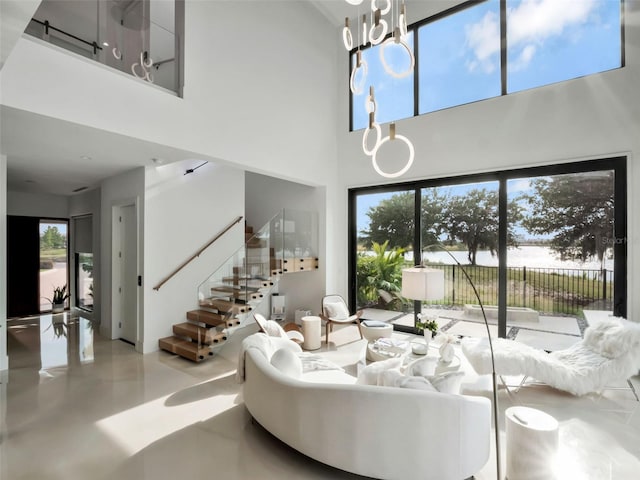 8157 Elion St, Orlando, FL 32827 - living room with a towering ceiling and stairway