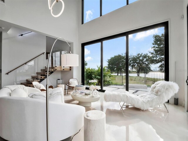 8157 Elion St, Orlando, FL 32827 - living room with stairs and a high ceiling