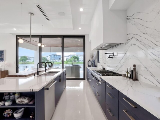 8157 Elion St, Orlando, FL 32827 - kitchen with modern cabinets, a sink, custom exhaust hood, recessed lighting, and stainless steel appliances