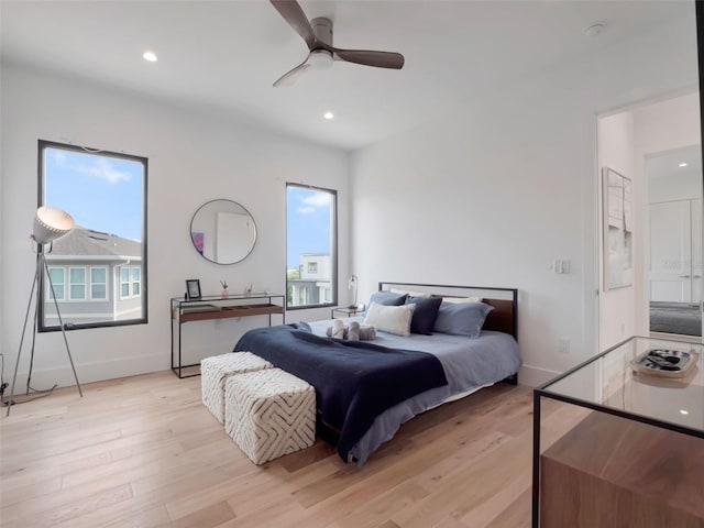 8157 Elion St, Orlando, FL 32827 - bedroom with light wood-style floors, multiple windows, baseboards, recessed lighting, and a ceiling fan