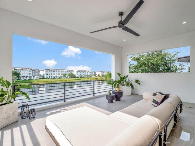 8157 Elion St, Orlando, FL 32827 - view of patio with ceiling fan, a water view, an outdoor living space, and a residential view