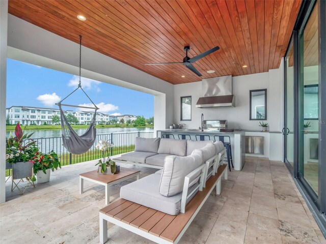 8157 Elion St, Orlando, FL 32827 - view of patio featuring an outdoor hangout area, exterior kitchen, a water view, a ceiling fan, and a sink