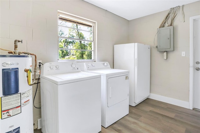laundry room with electric water heater, electric panel, light wood-style flooring, washer and dryer, and baseboards