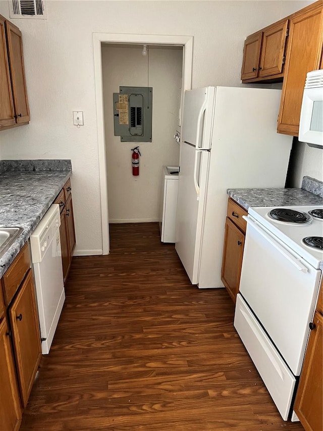 5291 Images Cir Unit 301, Kissimmee, FL 34746 - kitchen featuring white appliances, electric panel, brown cabinetry, and dark wood-type flooring