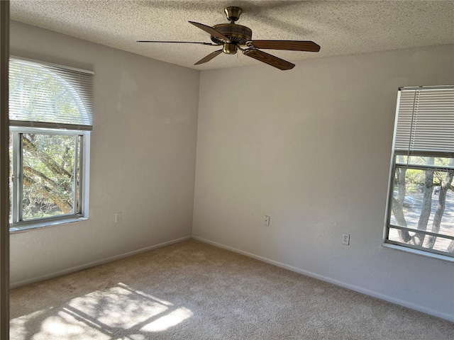 5291 Images Cir Unit 301, Kissimmee, FL 34746 - empty room with carpet floors, a ceiling fan, and a textured ceiling