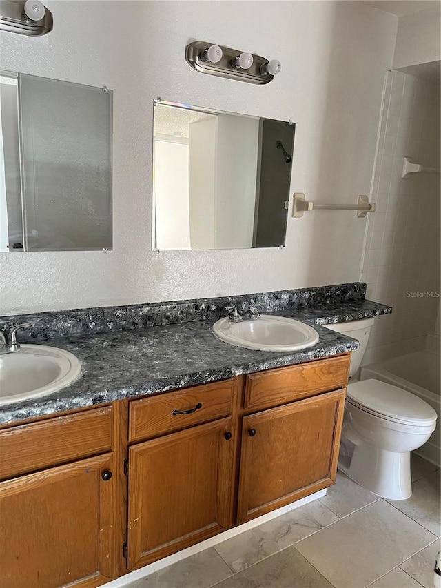5291 Images Cir Unit 301, Kissimmee, FL 34746 - full bathroom with double vanity, tile patterned flooring, and shower / tub combination