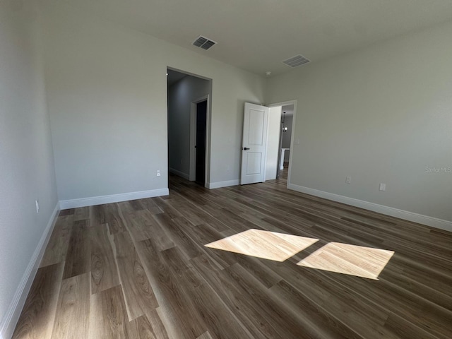 2336 SW 168th Loop, Ocala, FL 34473 - unfurnished bedroom with dark wood-style floors and baseboards
