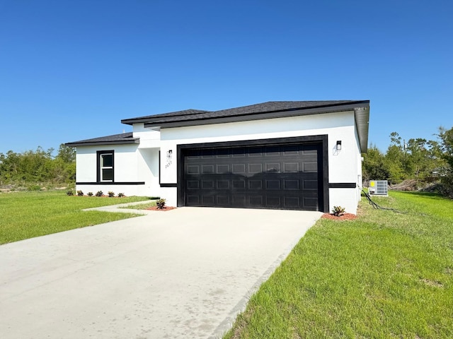 2336 SW 168th Loop, Ocala, FL 34473 - view of front facade featuring stucco siding, a front yard, an attached garage, driveway, and central AC