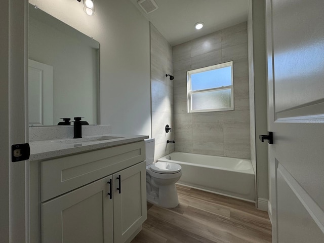 2336 SW 168th Loop, Ocala, FL 34473 - full bathroom with vanity, wood finished floors, toilet, and shower / washtub combination