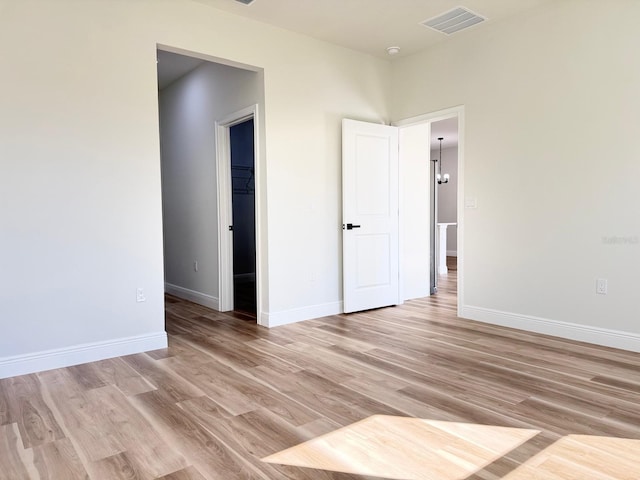 2336 SW 168th Loop, Ocala, FL 34473 - unfurnished room featuring light wood-type flooring and baseboards