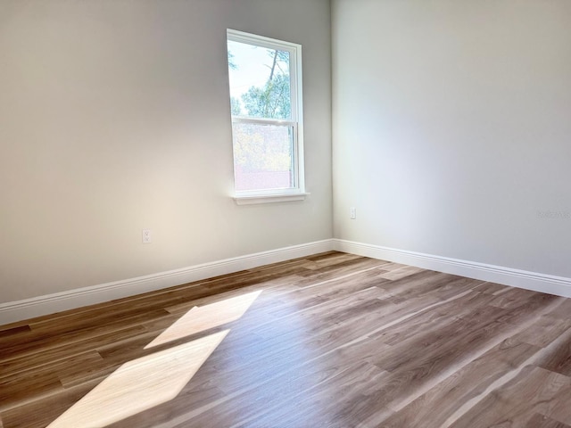 2336 SW 168th Loop, Ocala, FL 34473 - empty room featuring baseboards and wood finished floors