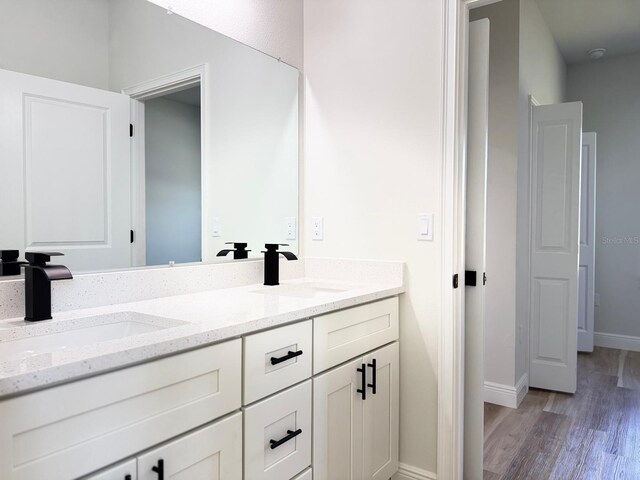 2336 SW 168th Loop, Ocala, FL 34473 - full bathroom featuring double vanity and wood finished floors