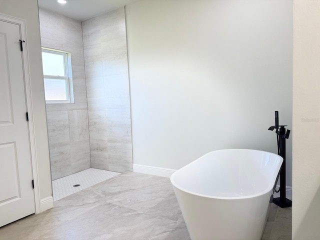 2336 SW 168th Loop, Ocala, FL 34473 - bathroom with a freestanding bath and tiled shower