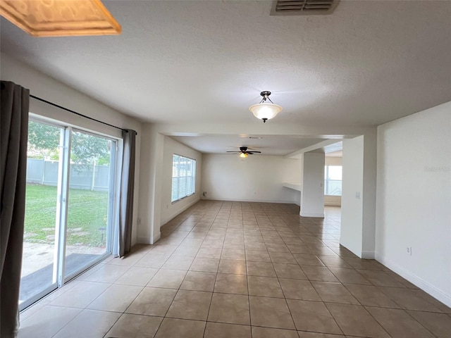 1325 Bella Coola Dr, Orlando, FL 32828 - unfurnished room with ceiling fan, light tile patterned floors, and a textured ceiling