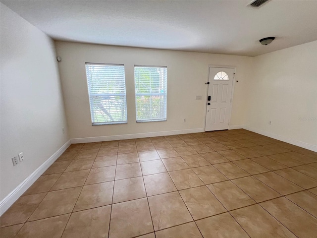 1325 Bella Coola Dr, Orlando, FL 32828 - entryway featuring light tile patterned flooring and baseboards
