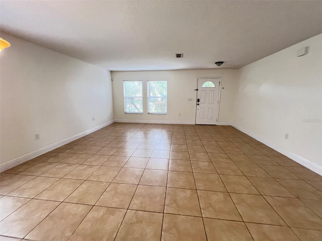 1325 Bella Coola Dr, Orlando, FL 32828 - foyer entrance featuring light tile patterned flooring and baseboards