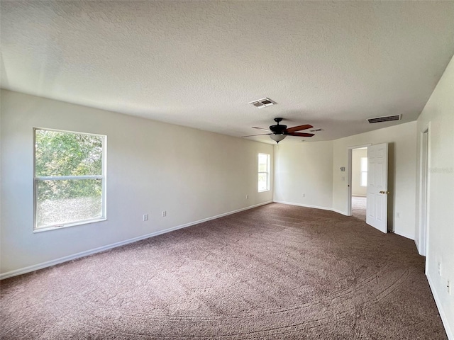 1325 Bella Coola Dr, Orlando, FL 32828 - unfurnished room featuring dark carpet, ceiling fan, and a textured ceiling