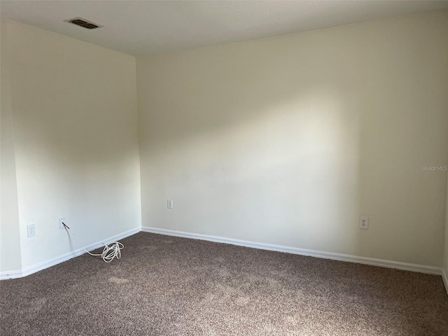 1325 Bella Coola Dr, Orlando, FL 32828 - spare room featuring dark colored carpet and baseboards