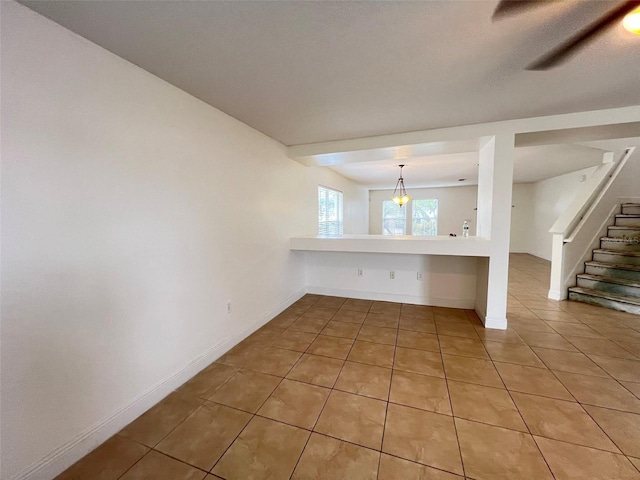 1325 Bella Coola Dr, Orlando, FL 32828 - empty room featuring light tile patterned flooring and stairs
