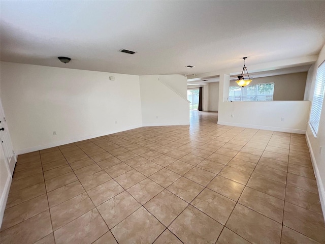 1325 Bella Coola Dr, Orlando, FL 32828 - empty room with light tile patterned flooring and baseboards