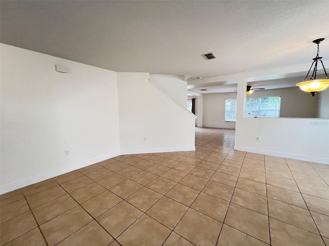 1325 Bella Coola Dr, Orlando, FL 32828 - empty room featuring light tile patterned floors and a ceiling fan