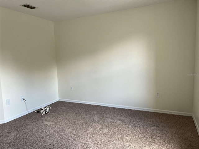 1325 Bella Coola Dr, Orlando, FL 32828 - spare room with dark carpet and baseboards
