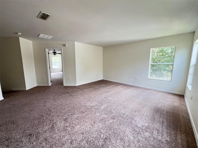 1325 Bella Coola Dr, Orlando, FL 32828 - carpeted empty room featuring a textured ceiling and baseboards