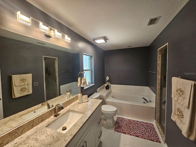 6436 Fig Leaf St, Magnolia Square, FL 34771 - bathroom featuring a shower stall, a textured ceiling, a garden tub, vanity, and tile patterned flooring