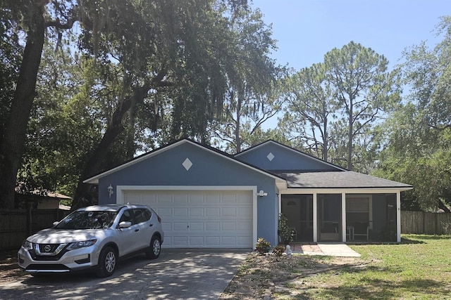 6436 Fig Leaf St, Magnolia Square, FL 34771 - ranch-style house featuring driveway, a sunroom, an attached garage, and a shingled roof