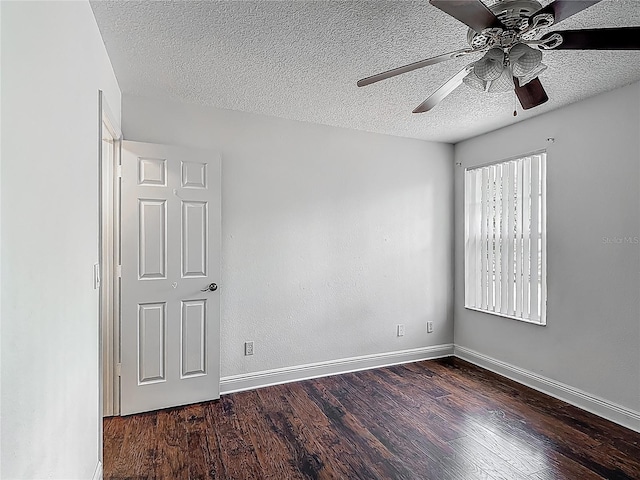 3234 Amberley Park Cir, Kissimmee, FL 34743 - spare room with a ceiling fan, dark wood-type flooring, baseboards, and a textured ceiling