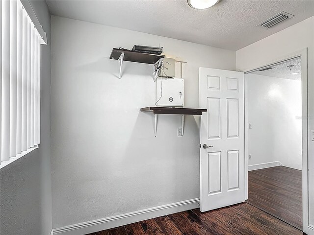 3234 Amberley Park Cir, Kissimmee, FL 34743 - walk in closet featuring dark wood-style flooring