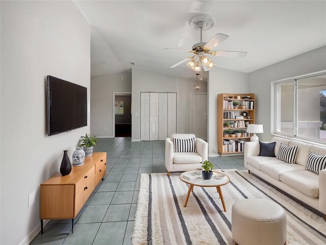 10350 SW 62nd Terrace Rd, Ocala, FL 34476 - tiled living area featuring a ceiling fan, lofted ceiling, and baseboards