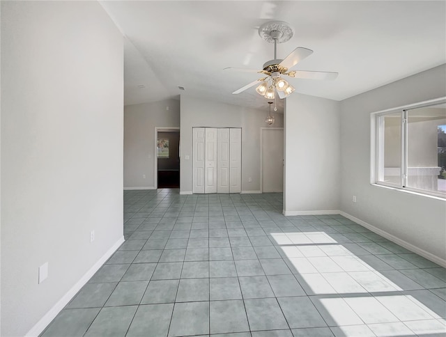 10350 SW 62nd Terrace Rd, Ocala, FL 34476 - unfurnished room with ceiling fan, light tile patterned flooring, lofted ceiling, and baseboards