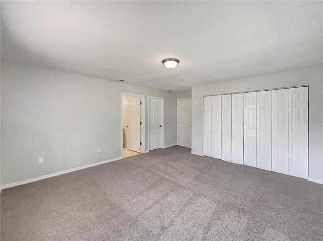 10350 SW 62nd Terrace Rd, Ocala, FL 34476 - unfurnished bedroom featuring baseboards and carpet flooring