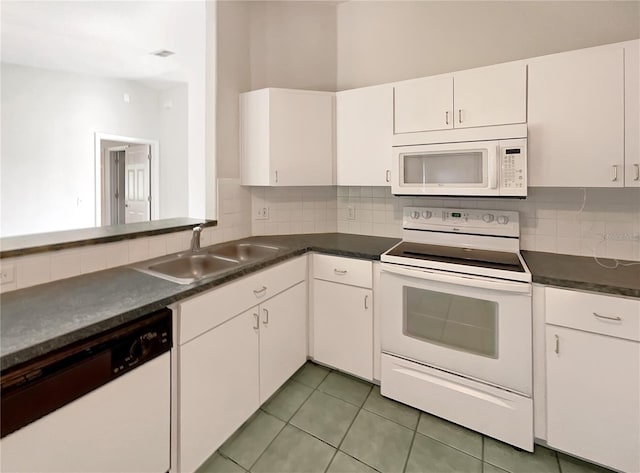 10350 SW 62nd Terrace Rd, Ocala, FL 34476 - kitchen featuring white appliances, a sink, decorative backsplash, white cabinetry, and light tile patterned floors