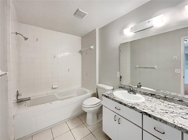 10350 SW 62nd Terrace Rd, Ocala, FL 34476 - full bathroom featuring toilet, tile patterned floors, bathing tub / shower combination, a textured ceiling, and vanity