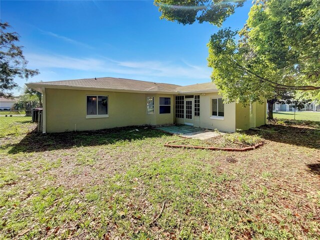 10350 SW 62nd Terrace Rd, Ocala, FL 34476 - rear view of property featuring stucco siding and a patio area
