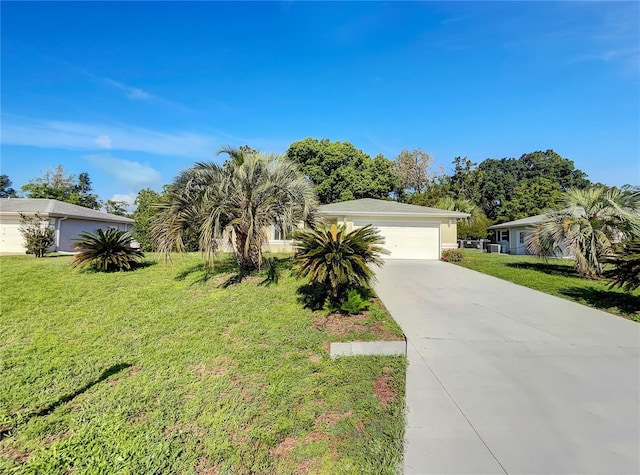 10350 SW 62nd Terrace Rd, Ocala, FL 34476 - view of front of house featuring a front lawn, driveway, and an attached garage
