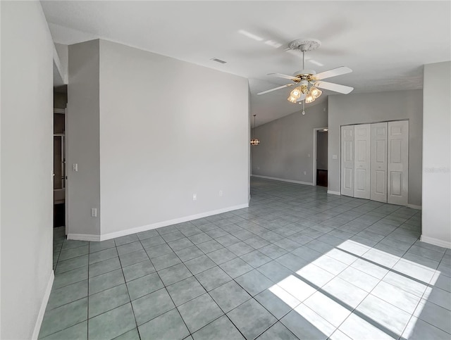 10350 SW 62nd Terrace Rd, Ocala, FL 34476 - tiled spare room featuring a ceiling fan, vaulted ceiling, and baseboards