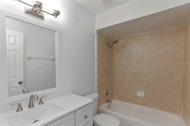 bathroom featuring toilet, vanity, and tub / shower combination