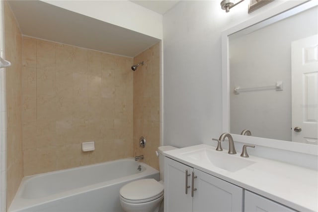 full bathroom with toilet, vanity, and shower / washtub combination