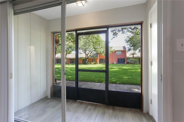 doorway to outside featuring wood finished floors